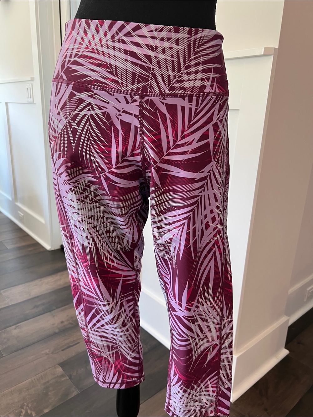 Double pocketed Tek Gear Pink and Burgundy Palm-Print Capri yoga pants